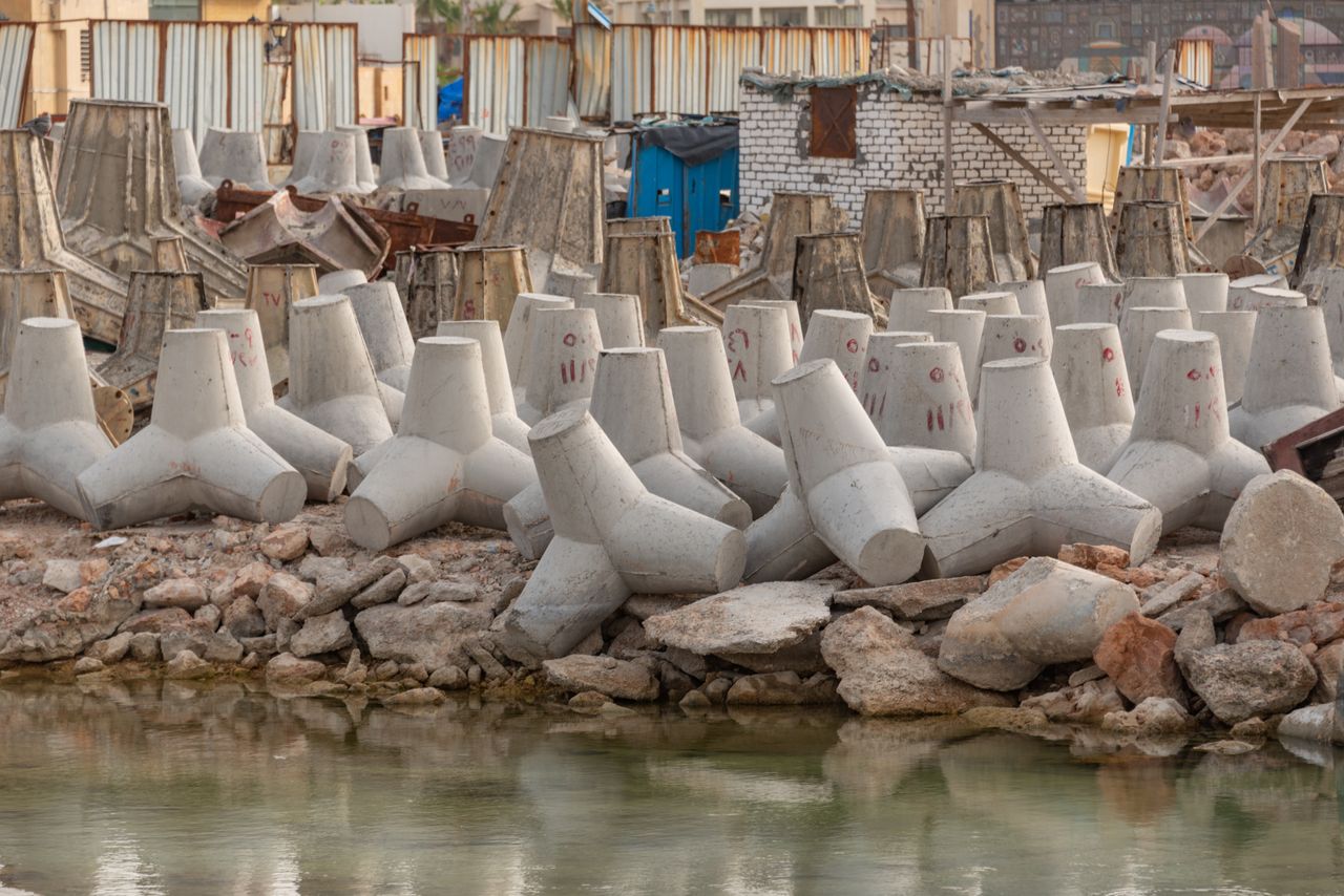 The Art of Drawing Readers In: Your attractive post title goes here Concrete tetrapods lining the industrial coastline for erosion control and coastal protection.