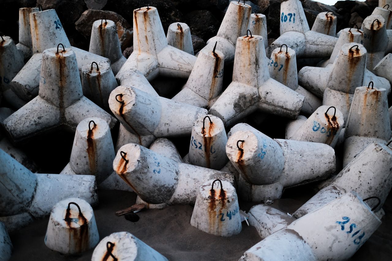 Pile of concrete tetrapods used for coastal protection in West Java, Indonesia.